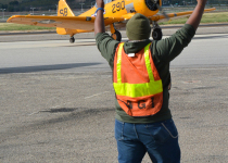 Cadet directing ramp traffic